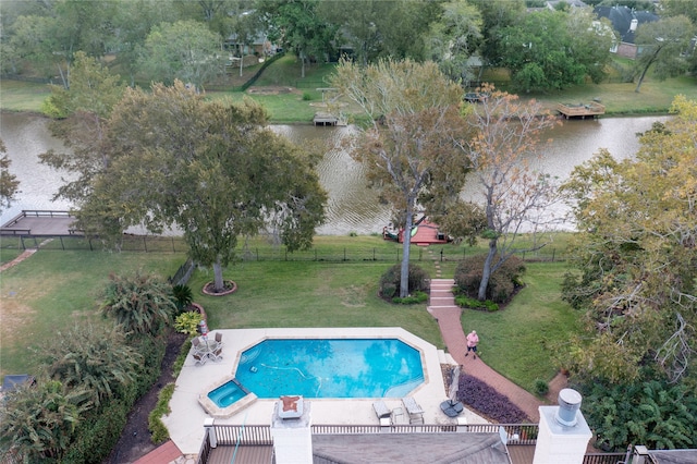 view of swimming pool with a water view, a patio, and a lawn