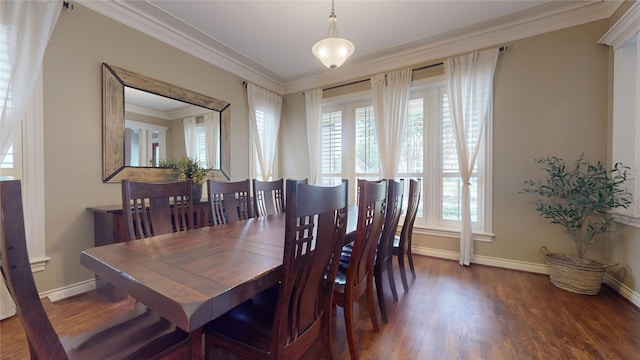 dining space with ornamental molding, dark wood-type flooring, and a wealth of natural light