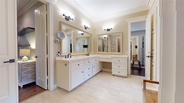 bathroom with vanity, ornamental molding, and wood-type flooring