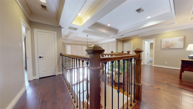 hallway featuring beamed ceiling, ornamental molding, coffered ceiling, and dark wood-type flooring