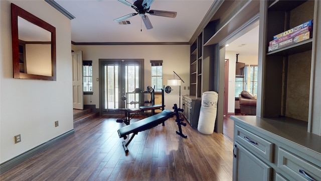 workout area with ornamental molding, french doors, ceiling fan, and dark hardwood / wood-style flooring