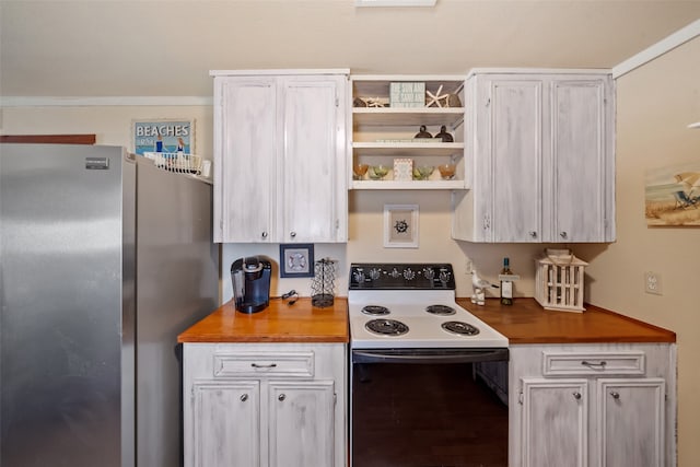 kitchen with electric range and stainless steel fridge