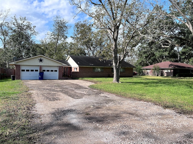 single story home with a garage and a front lawn