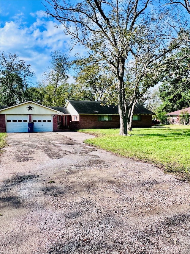 view of front facade with a front lawn and a garage