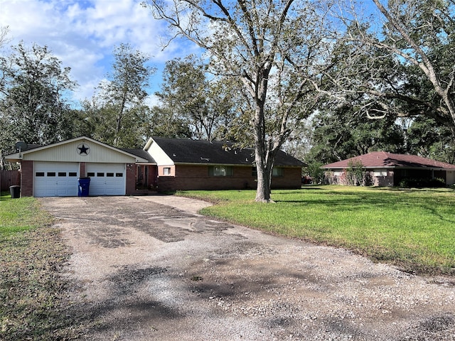 single story home with a front yard and a garage