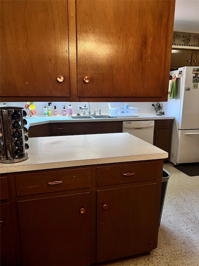 kitchen with white appliances and sink