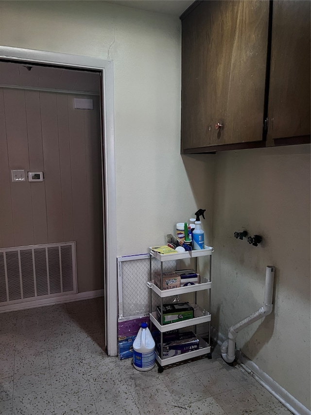 washroom featuring cabinets