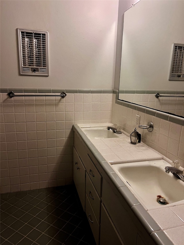 bathroom featuring tile patterned floors, vanity, and tile walls