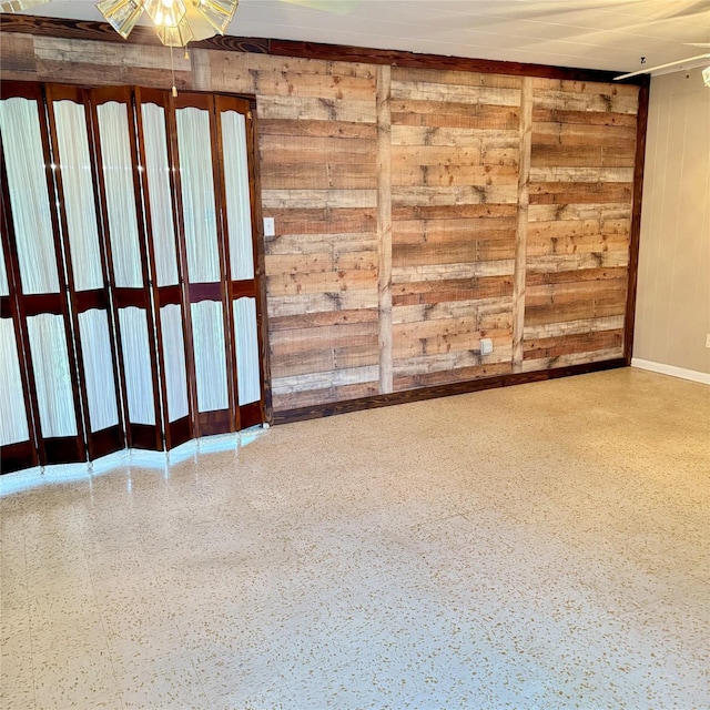 empty room featuring baseboards