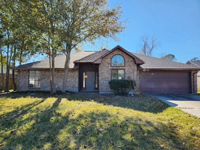 single story home featuring a front lawn and a garage