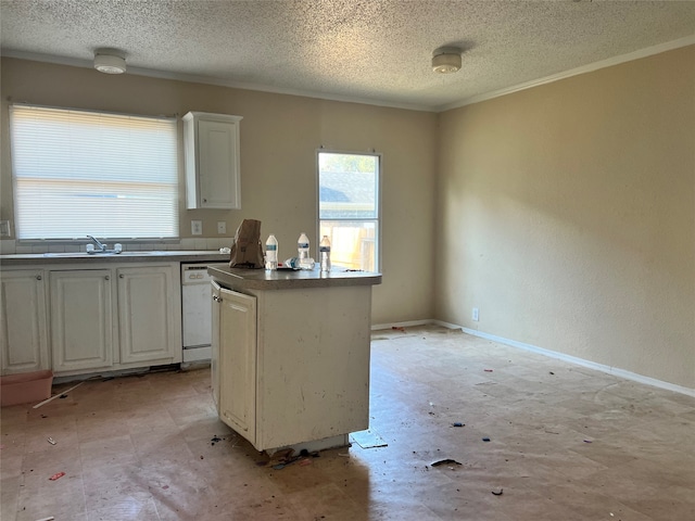 kitchen featuring dishwasher, sink, a center island, white cabinets, and a textured ceiling