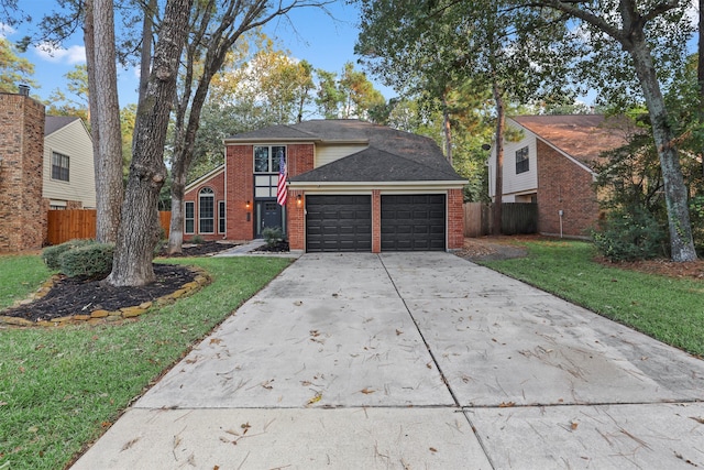 front of property with a front yard and a garage