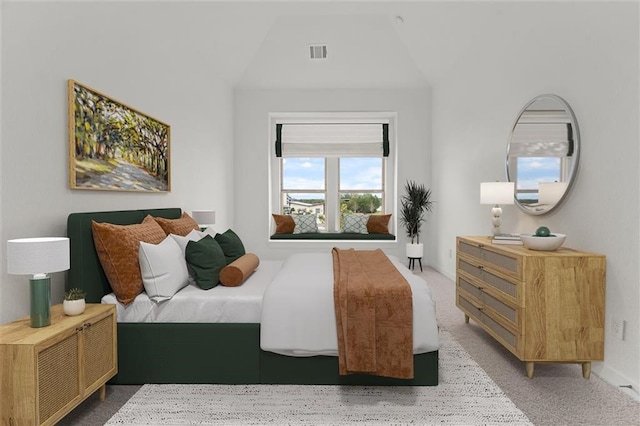 carpeted bedroom with vaulted ceiling