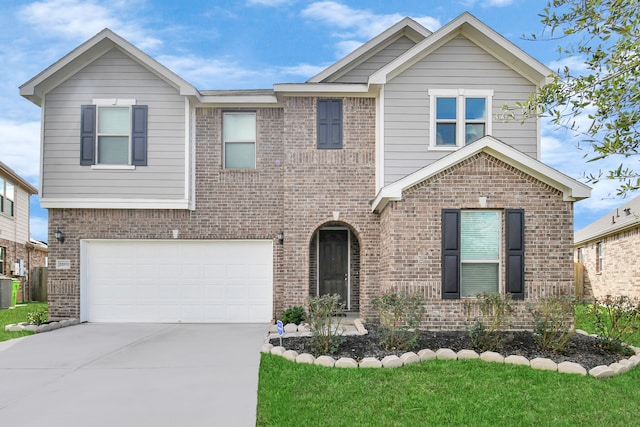 view of front facade featuring brick siding and driveway