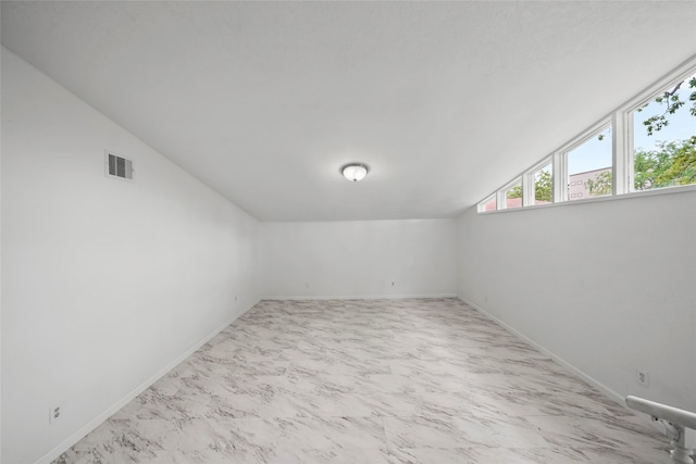 bonus room featuring lofted ceiling