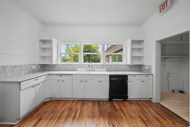 kitchen featuring white cabinetry, sink, black dishwasher, and dark hardwood / wood-style floors