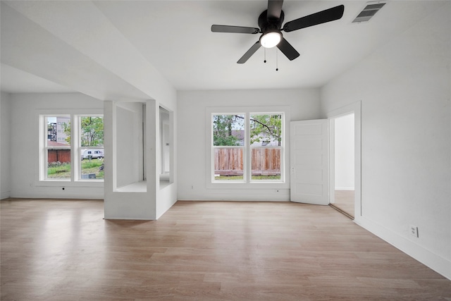 spare room with ceiling fan and light hardwood / wood-style flooring