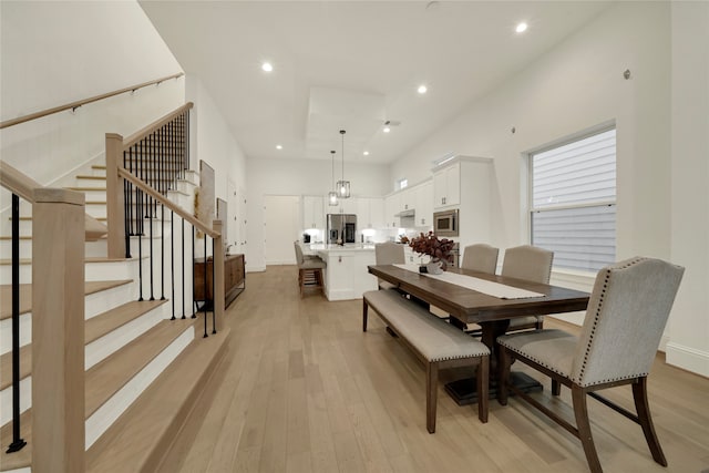 dining space with light wood-type flooring