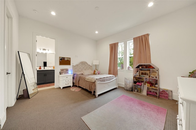 carpeted bedroom featuring ensuite bathroom