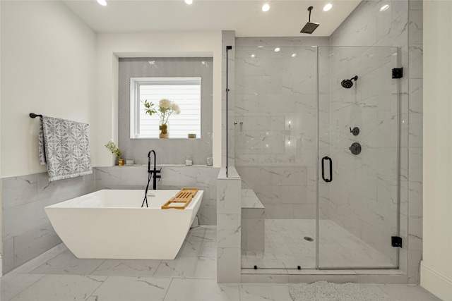 bathroom with separate shower and tub