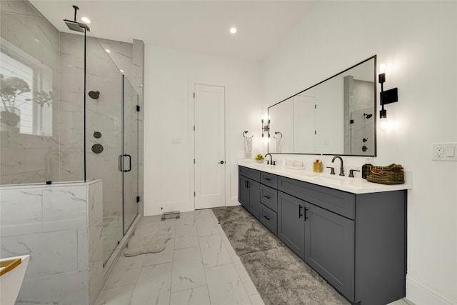 bathroom with an enclosed shower and vanity