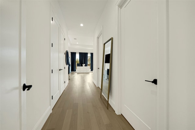 hallway featuring hardwood / wood-style flooring