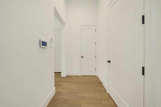 corridor featuring light hardwood / wood-style flooring