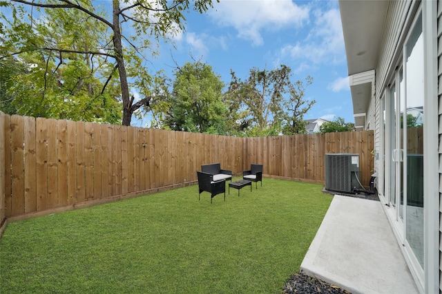 view of yard featuring central AC unit