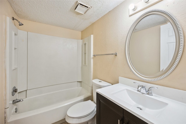 full bathroom featuring vanity, bathtub / shower combination, a textured ceiling, and toilet