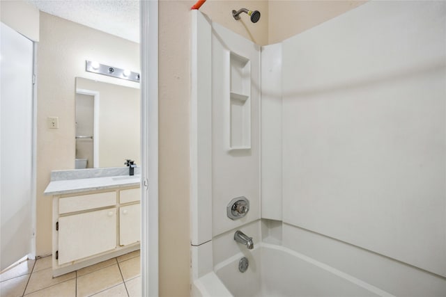 bathroom featuring vanity, shower / tub combination, a textured ceiling, and tile patterned floors