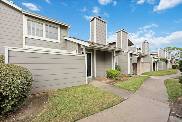 view of front of home featuring a garage and a front lawn