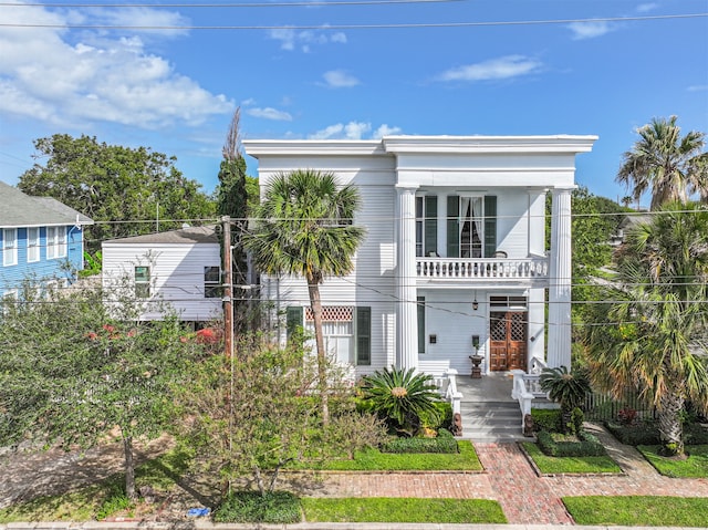 view of front of home with a balcony