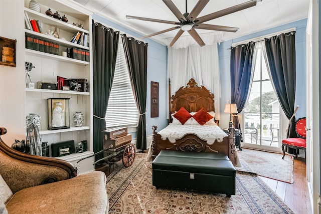 bedroom featuring ceiling fan, light hardwood / wood-style floors, and access to exterior