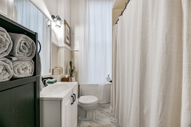 bathroom with vanity, toilet, and a shower with curtain