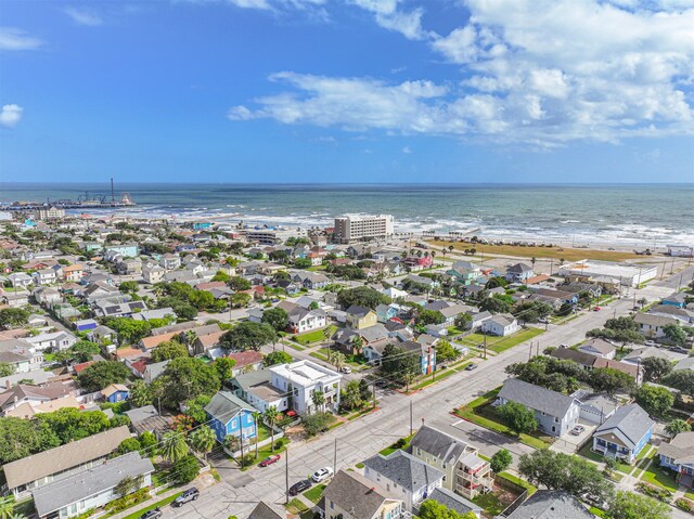 birds eye view of property with a view of the beach and a water view