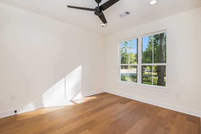 unfurnished room with wood-type flooring and ceiling fan