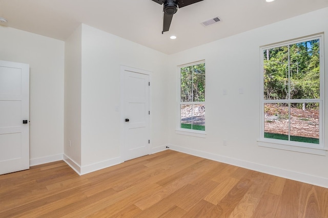 unfurnished room featuring ceiling fan and light hardwood / wood-style flooring