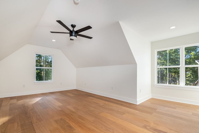 bonus room featuring a healthy amount of sunlight, lofted ceiling, light hardwood / wood-style floors, and ceiling fan