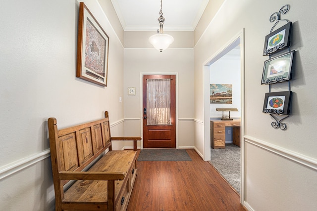 interior space with dark hardwood / wood-style floors and crown molding