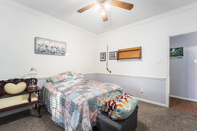 carpeted bedroom featuring ceiling fan and ornamental molding