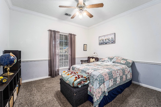 bedroom with ceiling fan, dark carpet, ornamental molding, and a textured ceiling