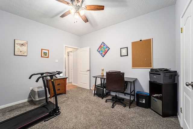 office space featuring a textured ceiling, carpet floors, and ceiling fan