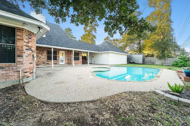 view of swimming pool with a patio