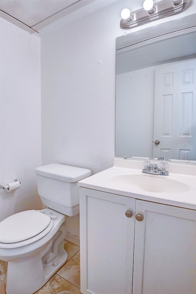 bathroom with tile patterned floors, vanity, and toilet