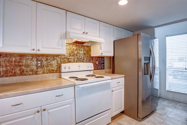 kitchen featuring tasteful backsplash, white electric range oven, white cabinetry, light tile patterned floors, and stainless steel refrigerator with ice dispenser