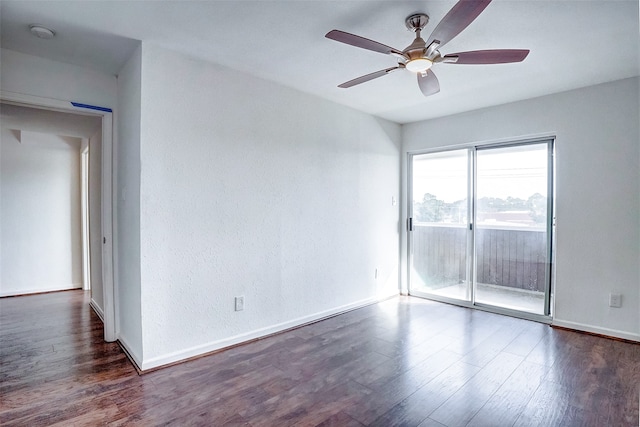 unfurnished room with ceiling fan and dark hardwood / wood-style floors