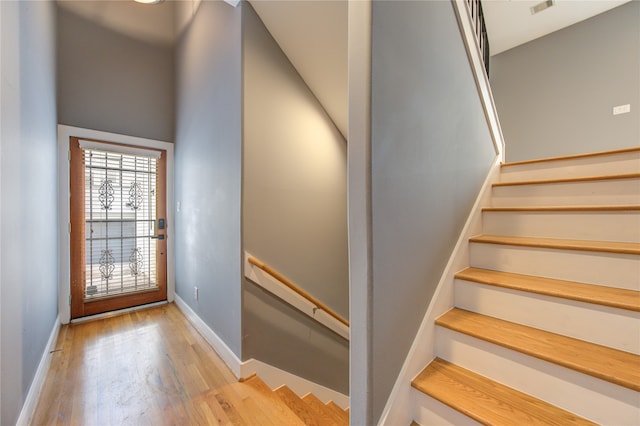 staircase featuring hardwood / wood-style flooring