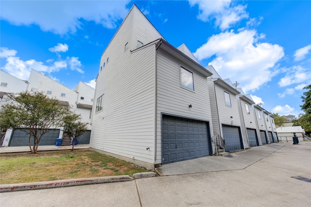 view of property exterior featuring a garage