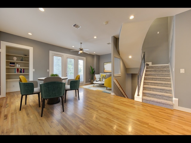 dining area featuring light hardwood / wood-style floors and ceiling fan