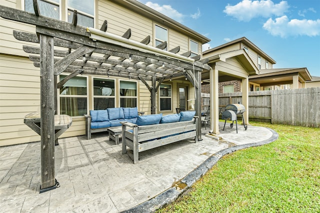 rear view of property featuring outdoor lounge area, a patio area, a lawn, and a pergola